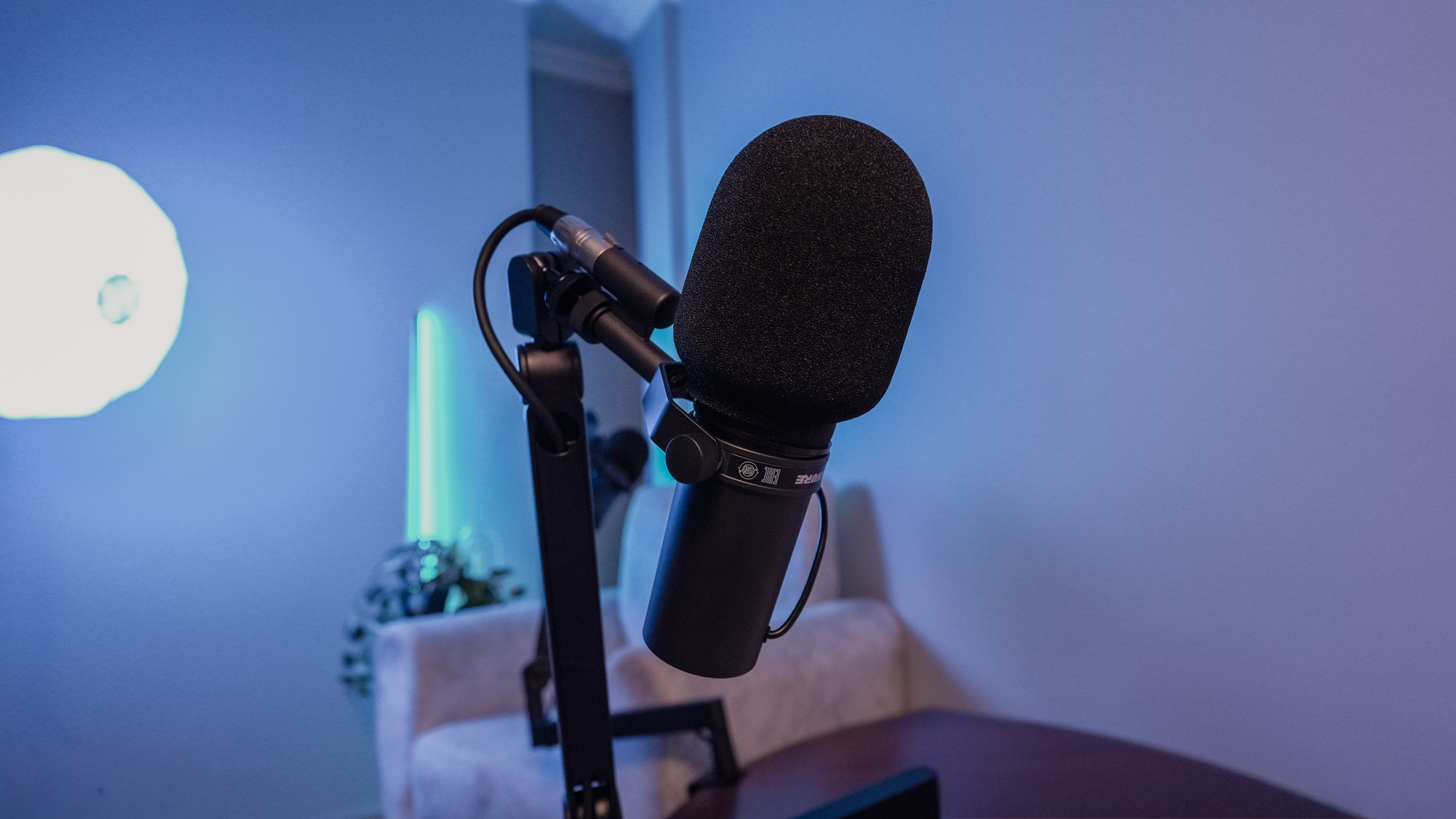 Shure broadcast microphone with windscreen close-up