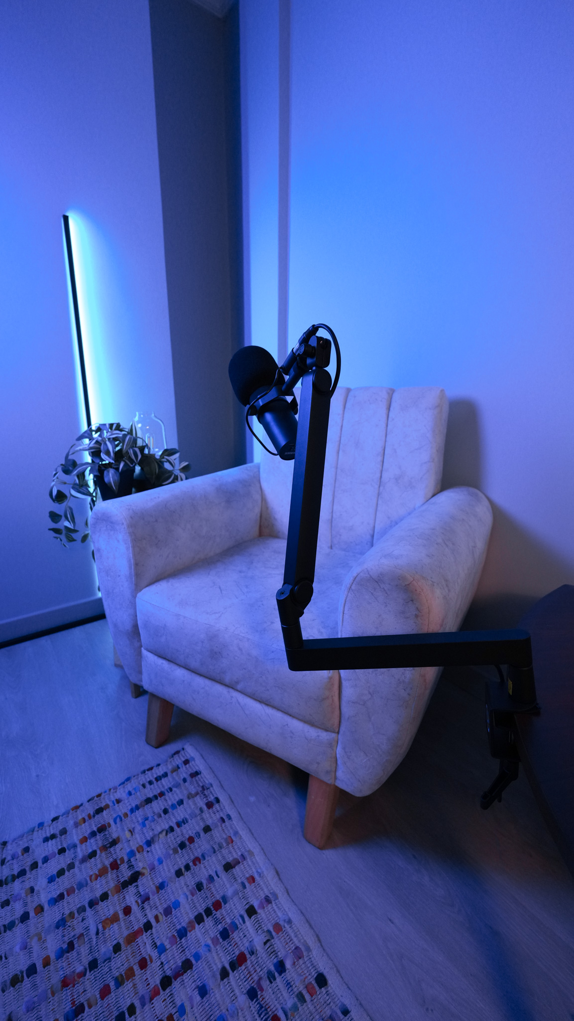 Podcast armchair with professional mic on articulating boom arm