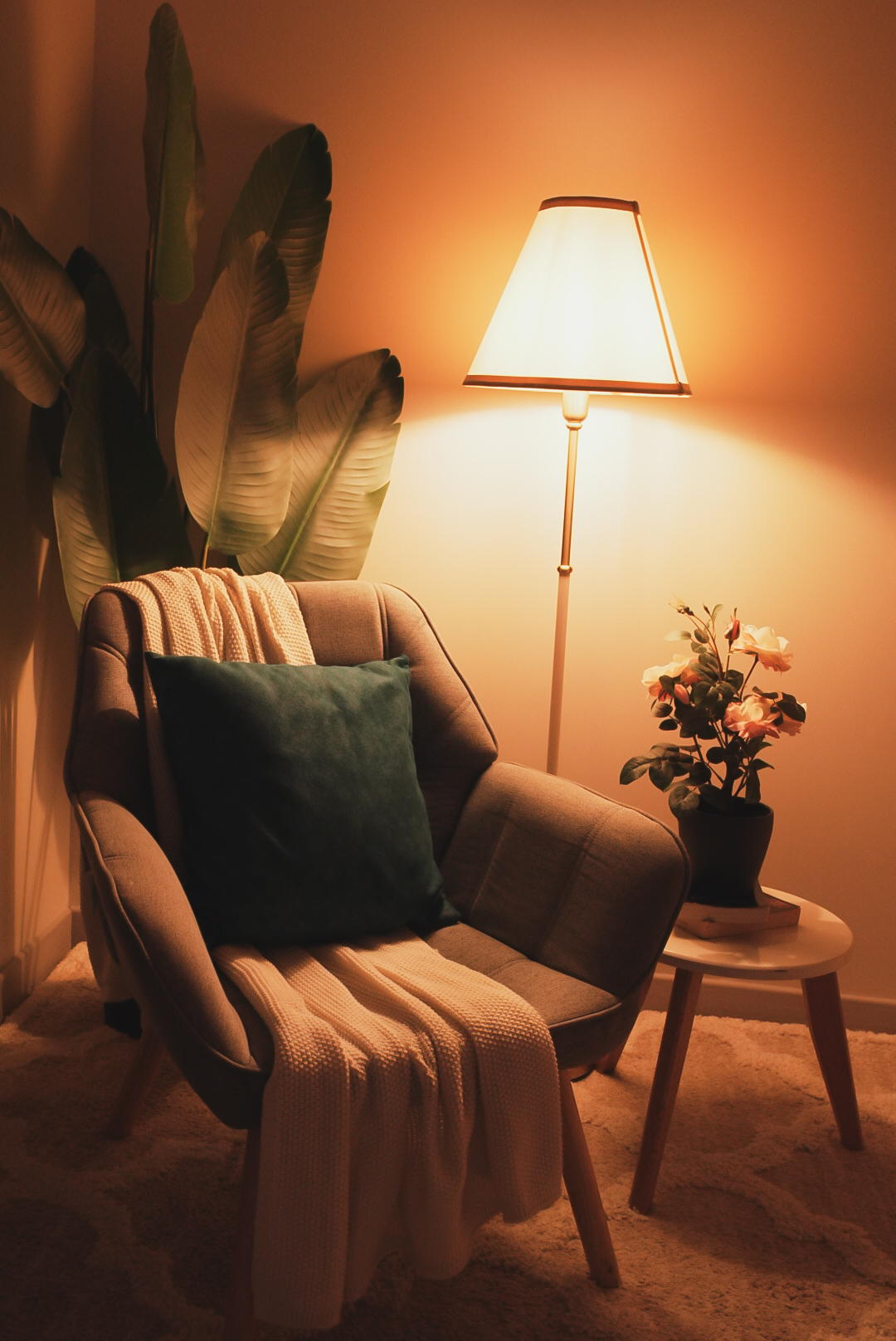 Cozy warm corner with armchair and lamp